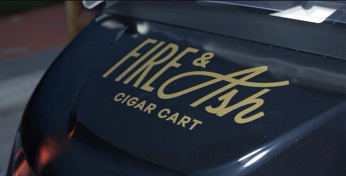 Fire and Ash gold wordmark, hand finished on gloss black