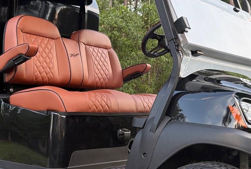 Hand stitched diamond quilting on cognac leather seats