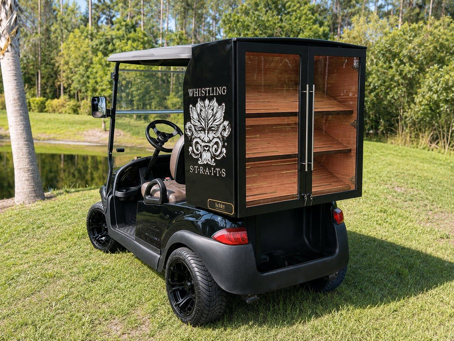 Whistling Straits cart, crest and lettering on the humidor side, shelving behind glass doors