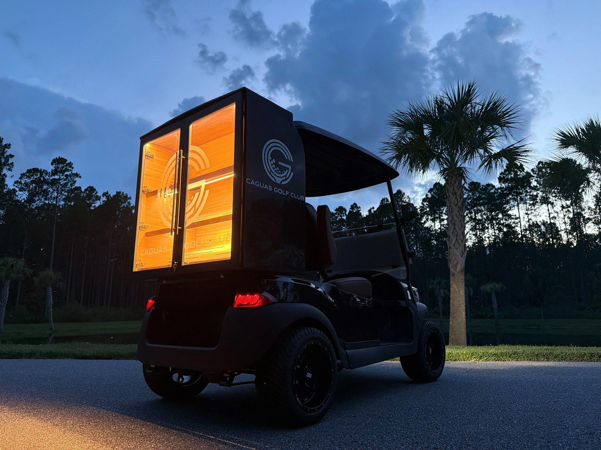 Finished cart glowing at dusk on the course